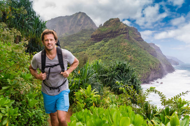 istock Happy Man Hiking Through The Jungle 645600884