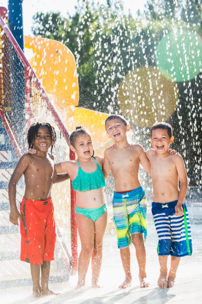 istock Multi-ethnic children at a water park 645600890