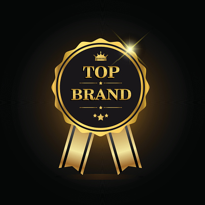 Top brand award label golden colored with ribbon and crown, vector illustration.