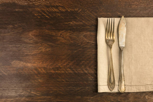 istock Vintage fork and knife on wooden background 645612422