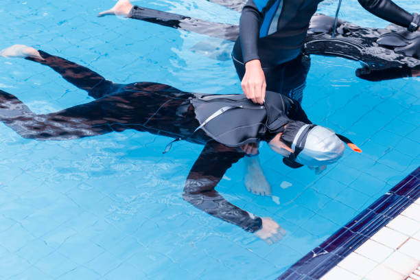 istock Free diving training on swimming pool 645618240