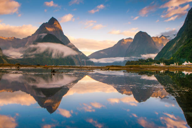 The Milford Sound fiord. Fiordland national park, New Zealand Famous Mitre Peak rising from the Milford Sound fiord. Fiordland national park, New Zealand milford sound stock pictures, royalty-free photos & images