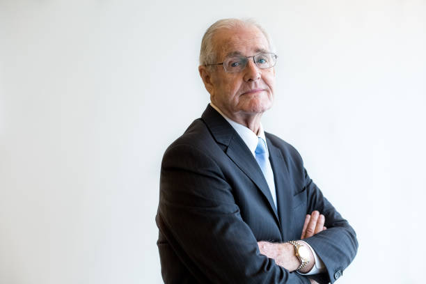 istock Handsome senior man with raised arms 645619080