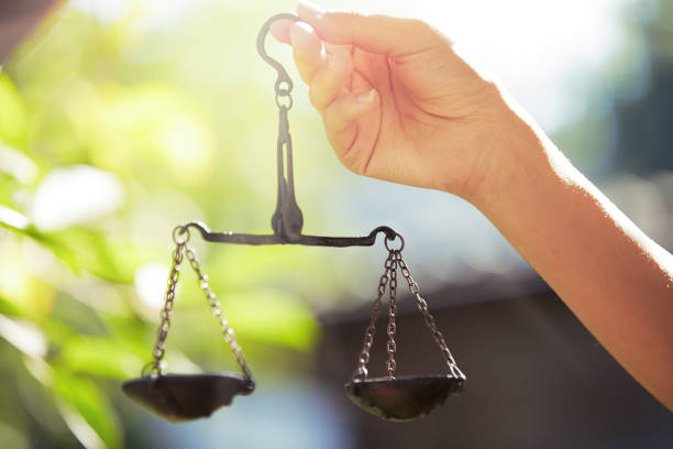 istock Woman hand holding scales 645622364