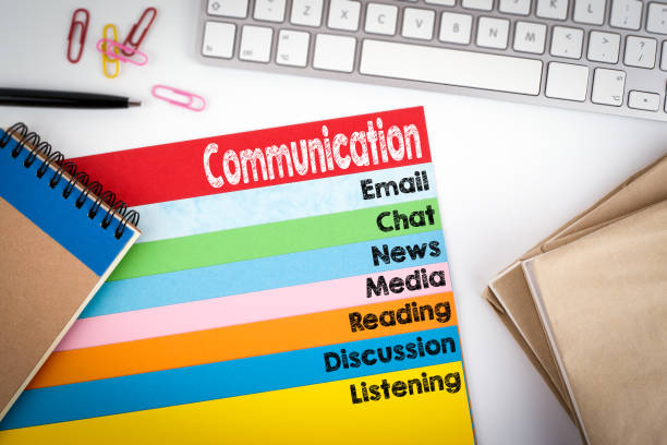 istock Communication. Office desk with a computer keyboard and color pages 645622796