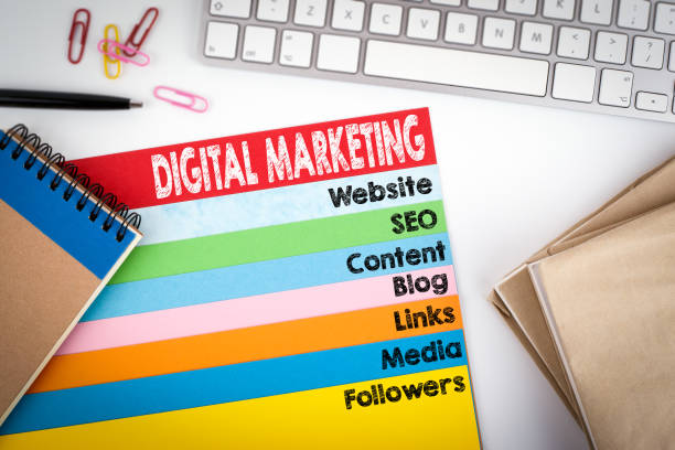 istock Digital Marketing. Office desk with a computer keyboard and color pages 645622804