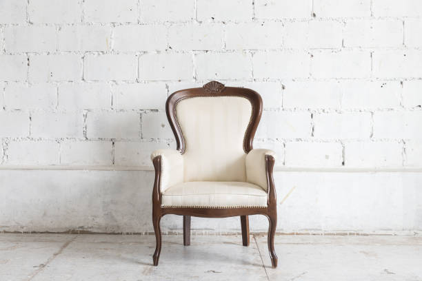 istock vintage armchair on white wall. 645625328