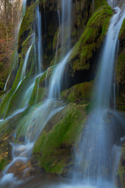 istock Pristine waterfalls deep in the woods, on a bright sunny day in spring 645625968