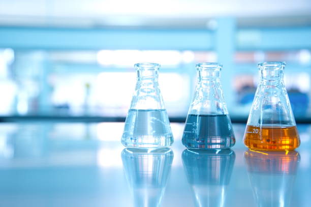 istock three flask of water black orange solution in science laboratory 645631786