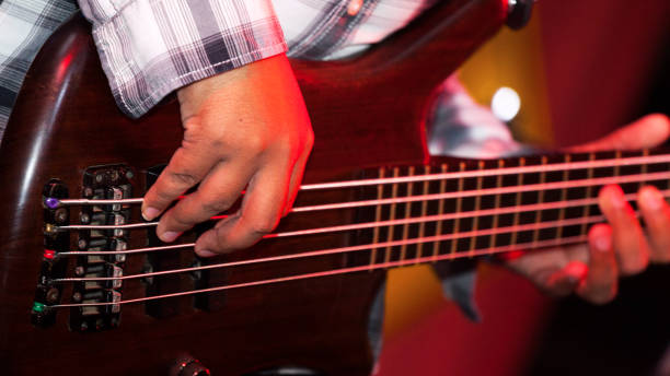 istock Playing strings of bass guitar 645631832
