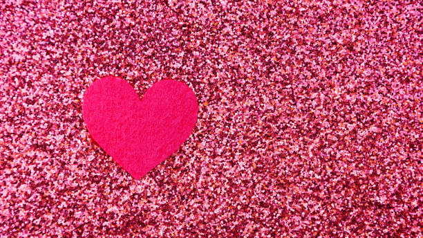 istock heart on a pink glitter abstracts for a background. 645635552