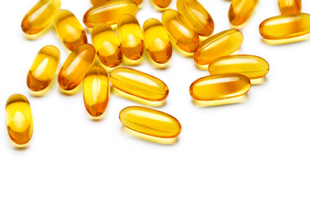 istock Fish oil capsules on white background. 645635646