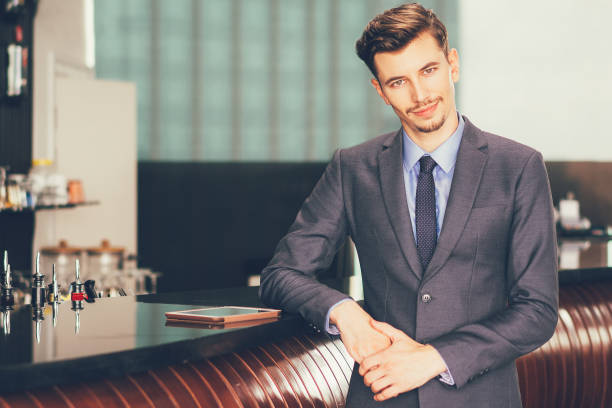 istock Friendly Middle-aged Businessman at Cafe Counter 645635892
