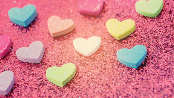 istock heart on a red glitter abstracts for a background. 645642430