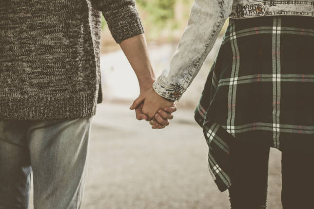 istock Couple holding hands outdoors. 645642878