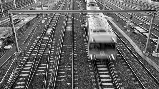 Black and White image of a train approaching Flinders Street Railway Station in Melbourne, Australia