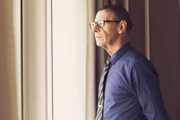 istock Thoughtful Senior Businessman Looking Out Window 645645950