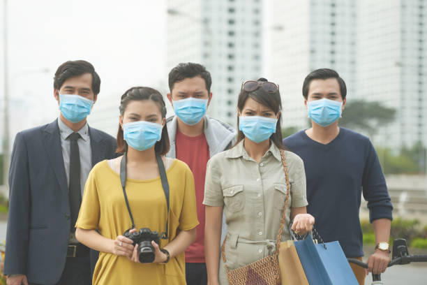 istock Unhappy Asian people with face masks 645647888