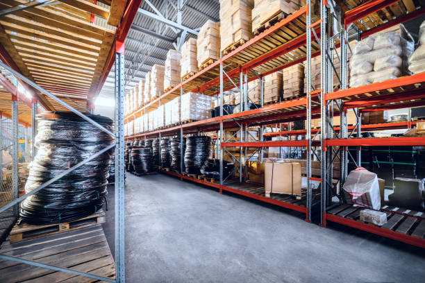 istock Long shelves with a variety of boxes and containers 645648414