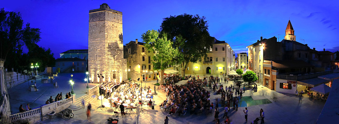 ZADAR, CROATIA - June 14 2014 - Five wells square in Zadar, Croatia. Open air Carmina Burana performance by Croatian military forces symphony and Kolo singing society. Panoramic view.