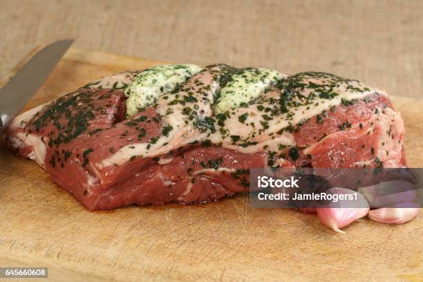 Lamb Joint With Garlic And Herbs Stock Photo - Download Image Now - Lamb - Animal, Lamb - Meat, Rolled Up