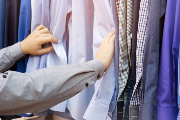 istock Young man shopping in the clothing store 645663232