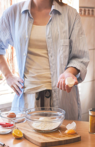 istock Kitchen disaster, bad cooking : woman hands and spilled egg 645663304