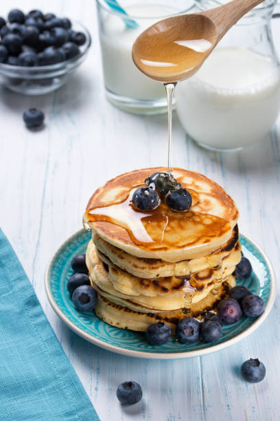istock Stack of pancakes with fresh blueberry and honey, healthy breakfast concept 645664426