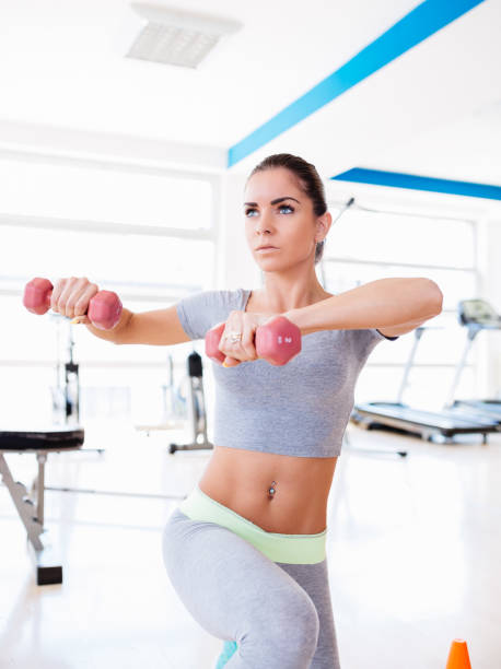 istock Young woman in gym 645667464