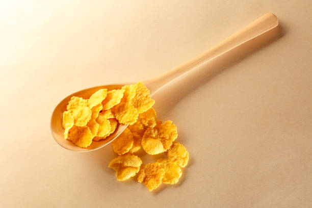 istock Wooden spoon with corn flakes 645693690