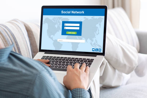istock man typing on notebook keyboard with social network on screen 645694058