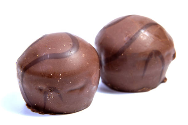 istock Chocolate candies isolated on white background. 645698322