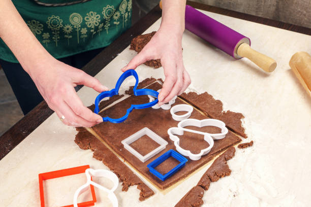 istock Cutting out dough for shaped as a rabbit gingerbread 645705648