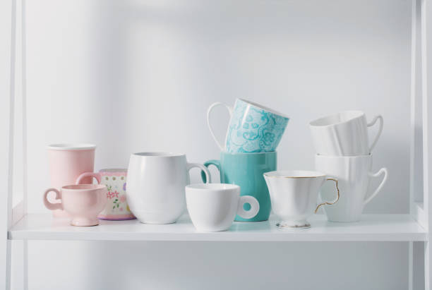 istock Clean dishes on white wooden shelf 645708074