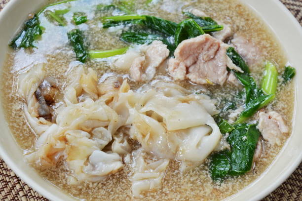 istock fried large noodle with pork in gravy sauce 645720650