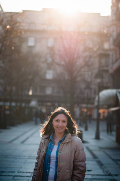 istock Smiling young woman at sunlight 645723144