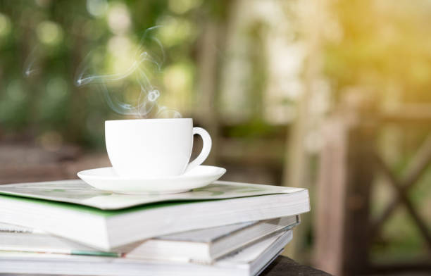 istock coffee and magazine with sunrise in garden 645727748