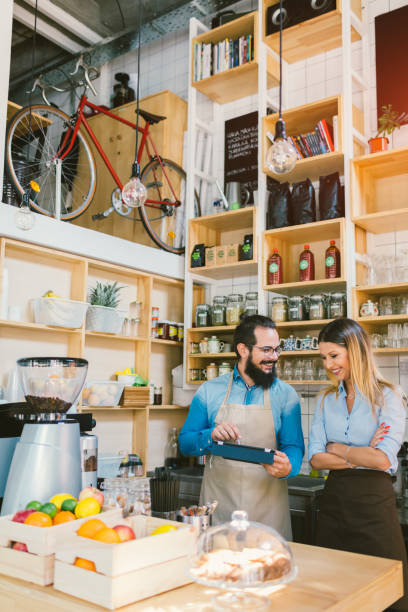 istock Young Woman And Her Colleague Working In Cafe 645729308