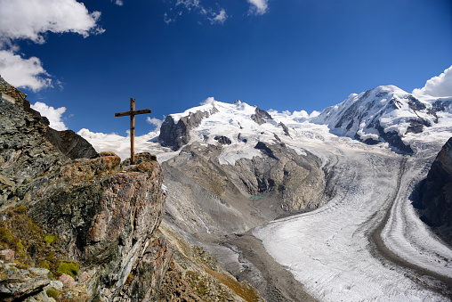 The  wooden cross and glacier at Gornergrat station in summer, Zermatt Switzerland