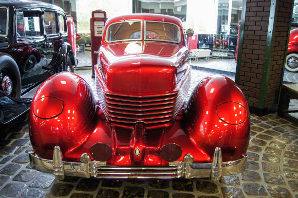 Dashboard of restored Dodge oldtimer seen in Bangkok. Cars is standing in street with open door.