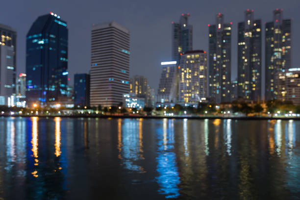 istock City office building and reflection blured lights 645738036
