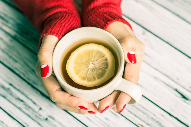 istock Woman holding a cup with tea 645744950