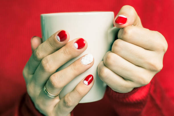 istock Woman holding a cup with tea 645745018