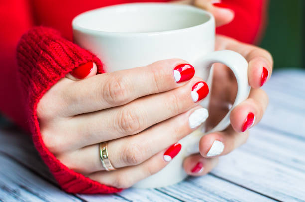 istock Woman holding a cup with tea 645745058