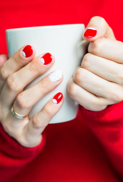 istock Woman holding a cup with tea 645745144