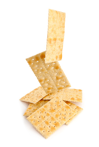 Crunchy and salty crackers isolated on white