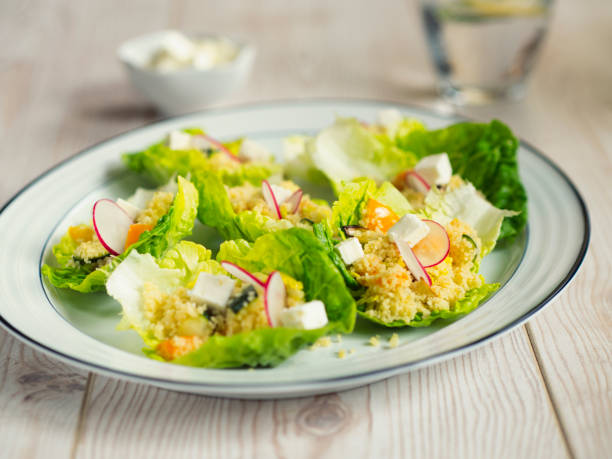 istock Couscous salad in baby gem 645749732