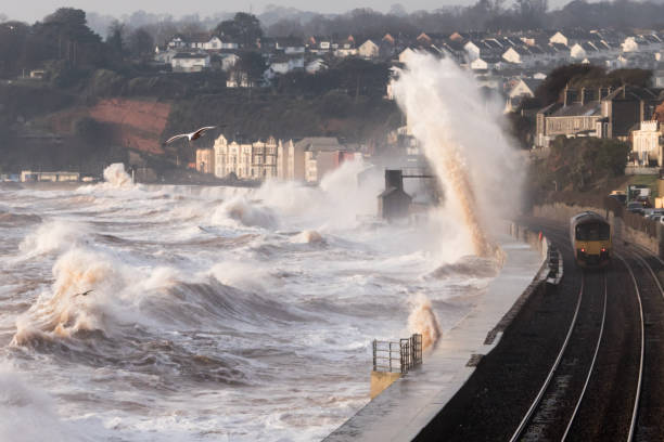 istock Storm waves at Dawlish breaking against sea wall 645752038