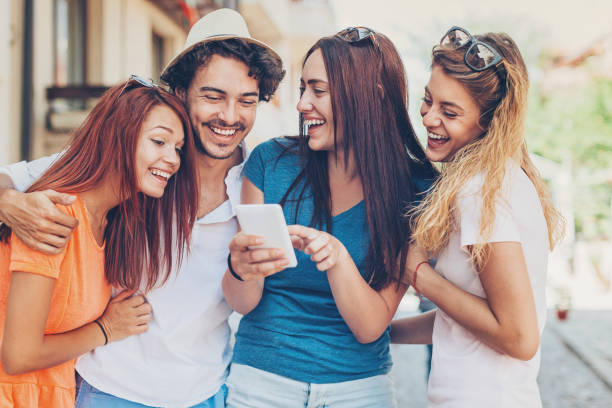 istock Friends laughing at funny message 645752534