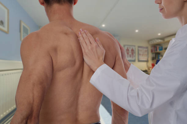 istock Man having chiropractic back adjustment . Osteopathy, Alternative medicine, pain relief concept. Physiotherapy, sport injury rehabilitation 645755848